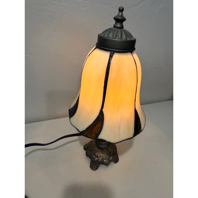 This stunning table lamp brings the rich elegance of the early 20th century straight into your home. Its timeless design...