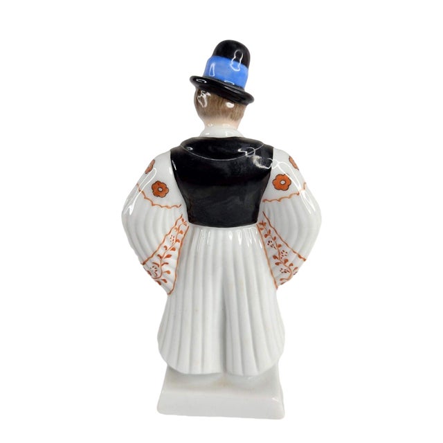 This exquisite Herend porcelain figurine features a beautifully hand-painted groom, showcasing delicate detailing and the...