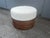 Round Rattan Ottoman, white boucle fabric seat. Ready for a new home. The ottoman is not signed.