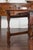 An English oak oval drop-leaf table from the late 19th century, with single drawer and baluster legs. Created in England...