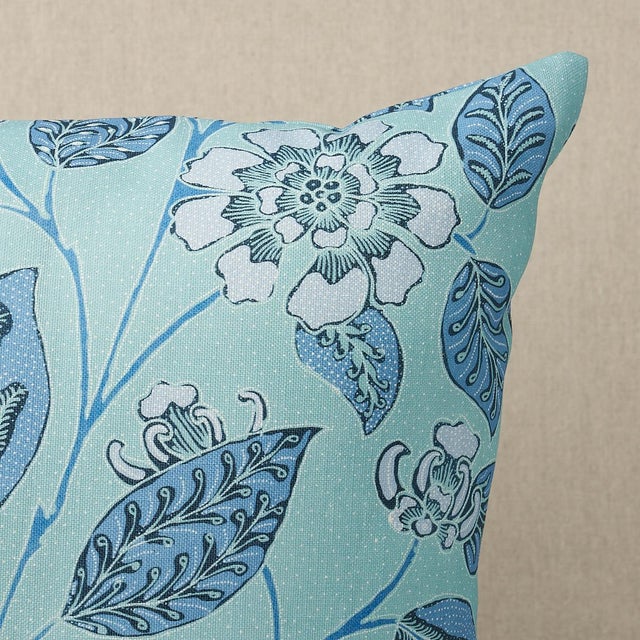 This pillow features Kava Cay Indoor/Outdoor with a knife edge finish. A loose, leafy floral inspired by a vintage batik,...