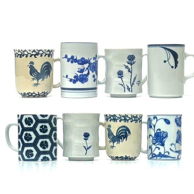 Blue and white ceramic mugs, group of 8. A gorgeous set of blue and white china mugs, featuring an assortment of shapes...