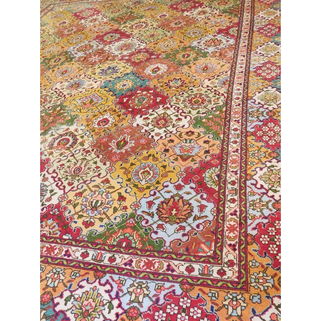 Tabriz carpet hand knotted in various colors with trellis design, decorated with stylized leaf and floral ornaments and...