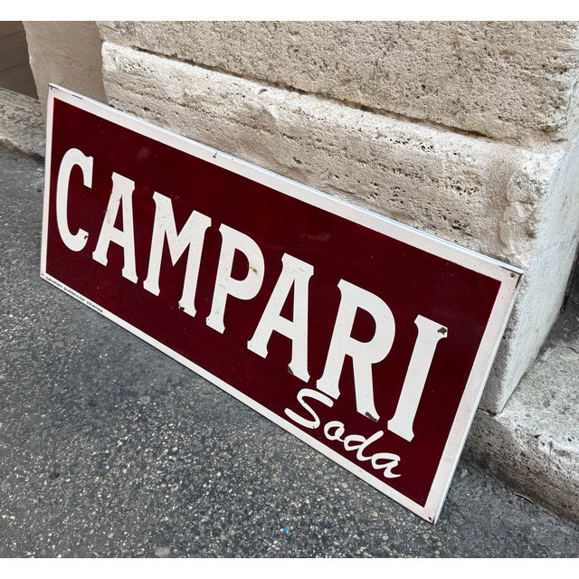 Gorgeous vintage metal sign with a deep red background and embossed white lettering, iconic and instantly recognizable...