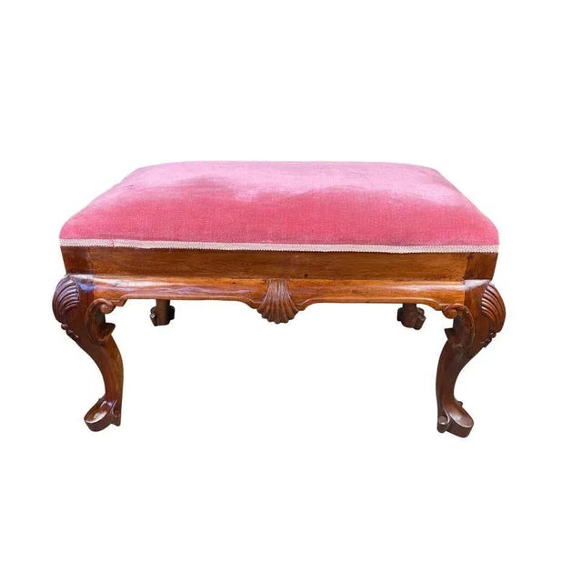 This gorgeous 20th century powdered pink, queen ann stool would fit perfectly in any rustic, wooden themed room next to a...