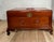 A beautifully crafted Mid-Century Chinese Ming Revival blanket chest featuring a richly figured hardwood exterior and...