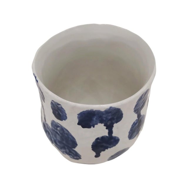 Playful and full of personality, this ceramic vase set features sculptural, rounded forms brought to life with hand-...