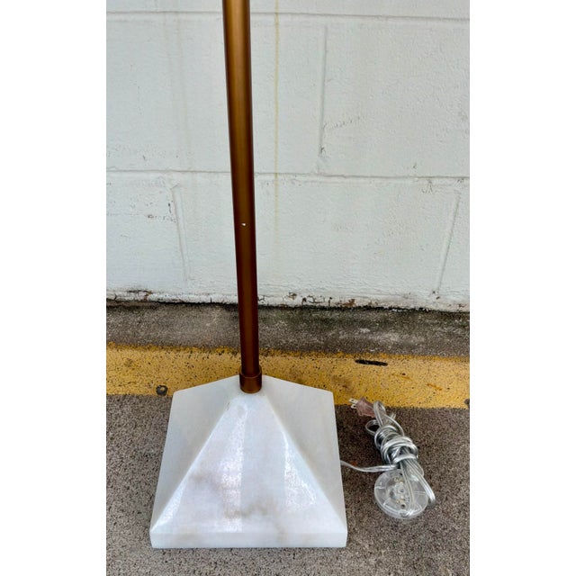 Stylish Currey & Company Modern Antique Brass Repertoire Floor Lamp, white marble base, showroom floor sample