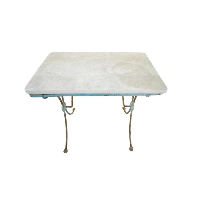 Discover a stunning pair of antique French garden tables from the 19th century, expertly crafted with intricate details...