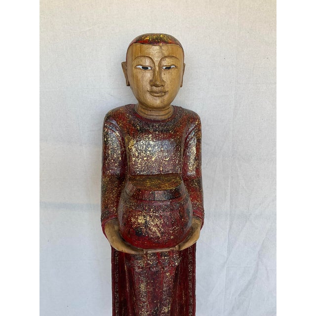 Vintage Buddha Buddhist Carved Wood Burmese Thai Monk Statue in good estate condition. There are nicks to the bottom....
