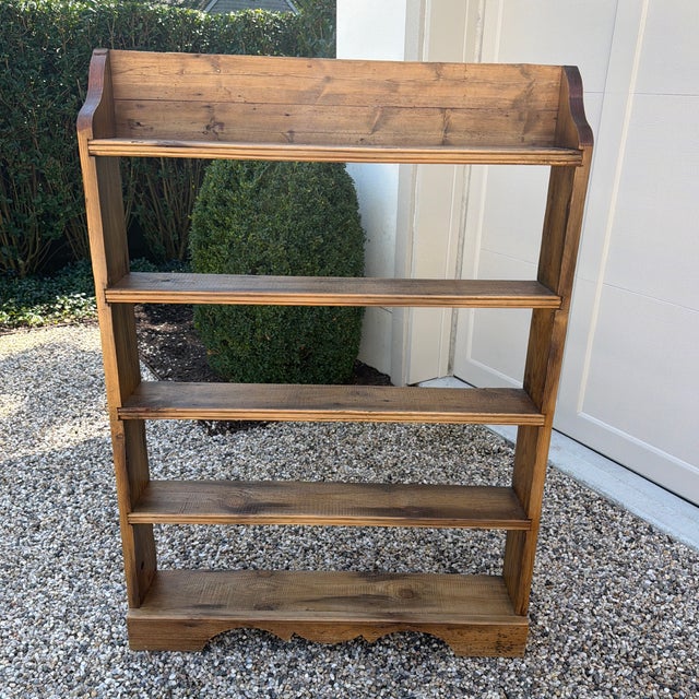 Charming vintage pine bookcase with a wonderfully warm naturally aged finish. Its unusually shallow profile features four...