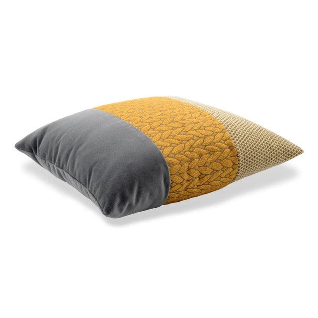 Decorative band square cushion that combines a tricot jacquard fabric with the soft cotton velvet and a false unit fabric,...