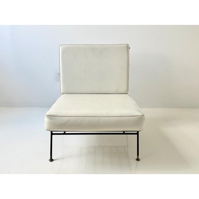 Wrought iron outdoor lounge chair with white vinyl cushions, 1950s . In the style of Pacific Iron Works chairs, but...