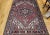 4’ 10” x 6’ 7” Vintage Persian Heriz area rug in a medallion pattern from the 2nd quarter of the 1900s. Beautiful...