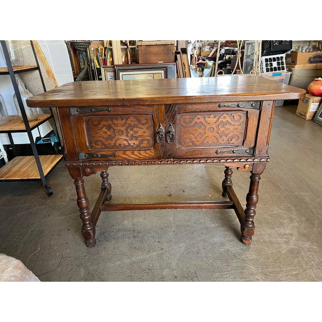 An early 20th century Jacobean Style Console , Server or sideboard. Features a rectangular top legs connected by an H...