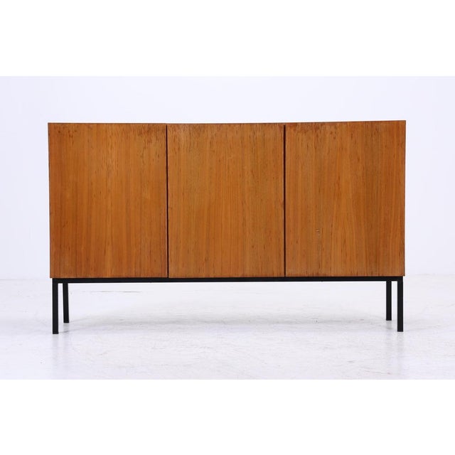 Beautiful vintage highboard from the 60s *Timeless vintage design * 3 doors * Material: Wood * 2 shelves DIMENSIONS &...