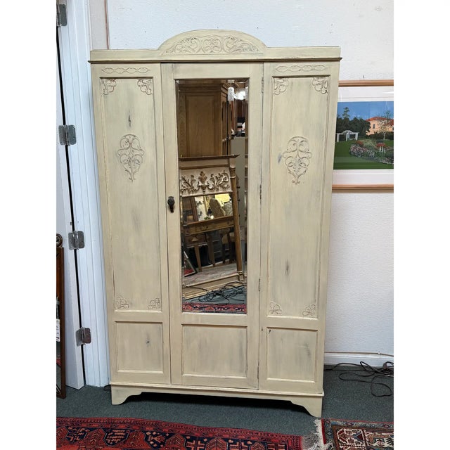 Design Plus Gallery presents a Linen Press/Armoire with Provincial Details. The armoire has three front panels that...