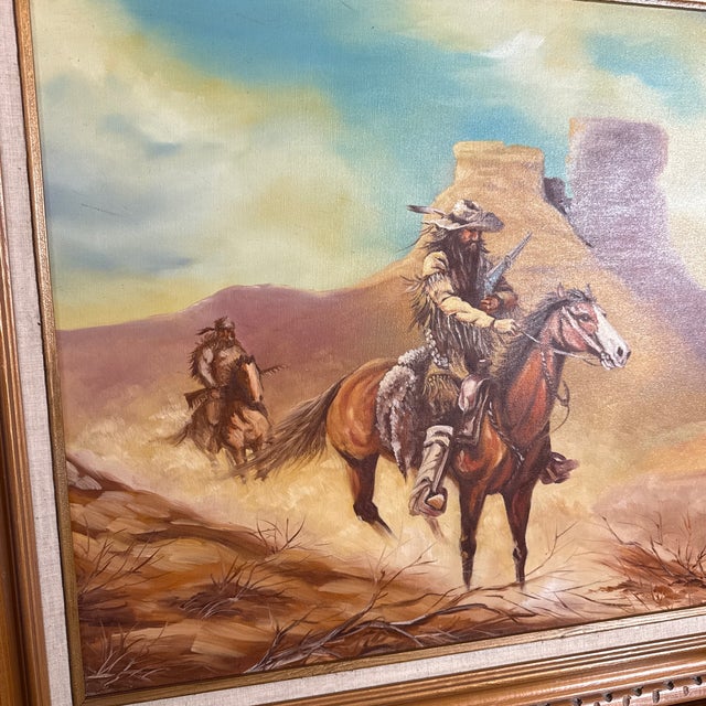 Add classic Western charm to your home décor with this beautifully framed vintage-style painting. The artwork features two...