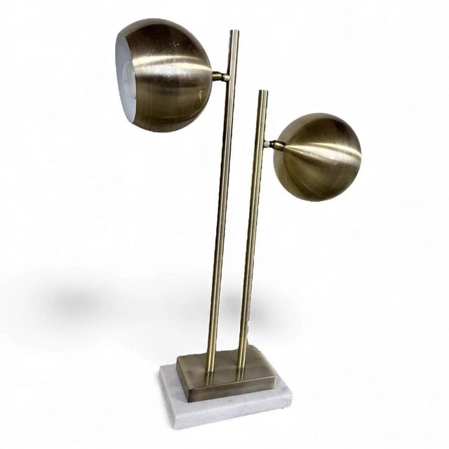 This vintage brass lamp is a stunning mid century table lamp designed to bring warm ambient light and sculptural elegance...