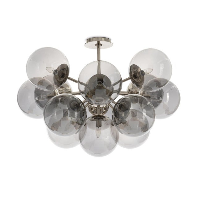 The Shine Flush Mount epitomizes contemporary sophistication with a touch of mid-century modern influence. The fixture...
