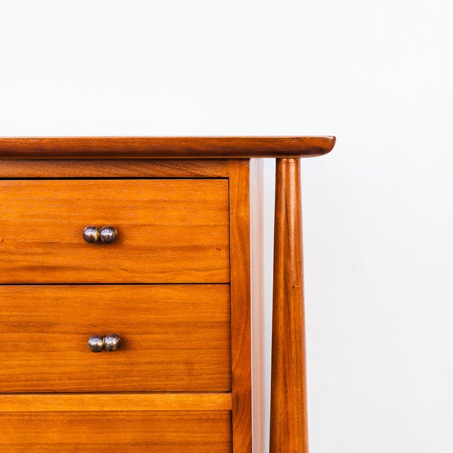 A newly refinished 1950s mid century modern exoskeletal walnut highboy chest of drawers with brass hardware by Mount Airy...