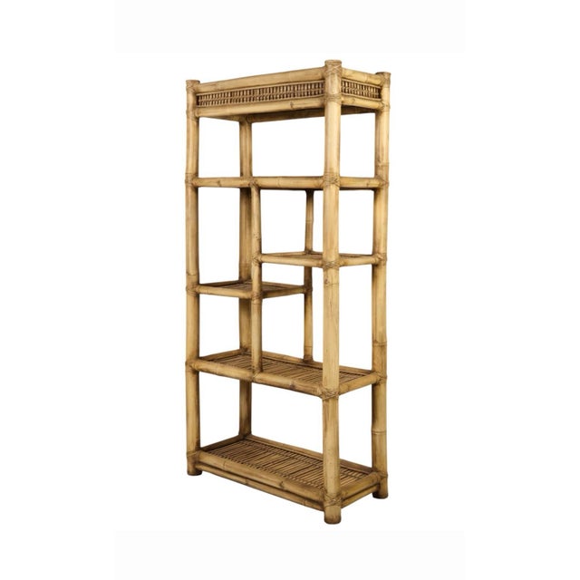 An exceptional vintage Mid-Century modern etagere bookcase designed in the iconic Palm Beach Regency taste. This striking...