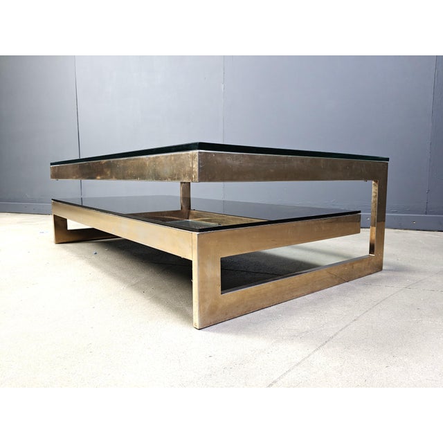 Quality 23kt gold layered and thick clear glass two tier coffee table manufactured by Belgochrom. This table is a popular...