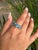 This stunning 925 Sterling Silver ring showcases the brilliance of three oval-cut Blue Topaz gemstones, beautifully...