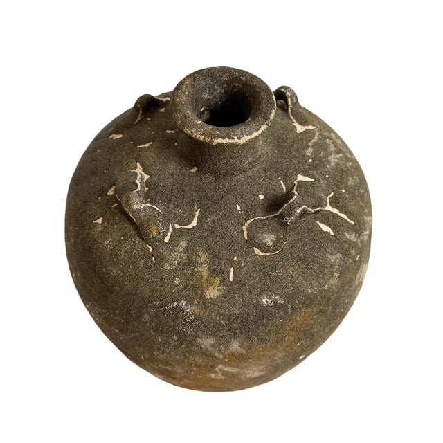 Antique small earth ware pots from the coast of Indonesia. Each is wonderfully unique and size, patina, and details vary....