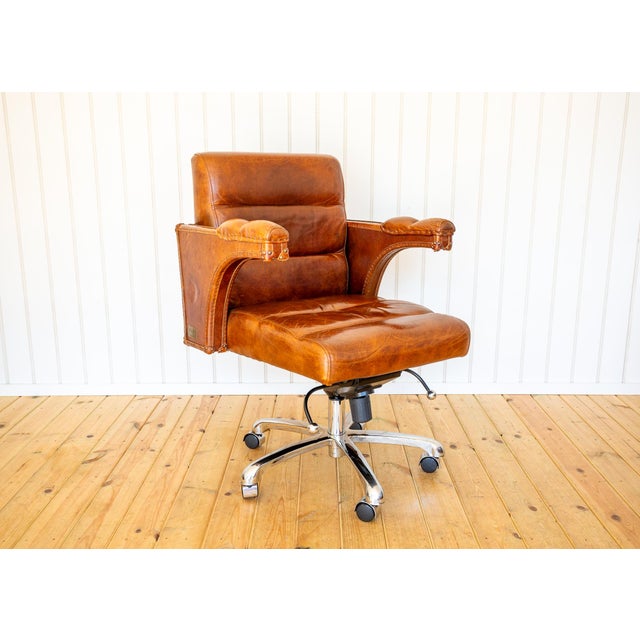 A strikingly attractive and very comfortable executive leather designer desk armchair in lovely condition. Designed by...