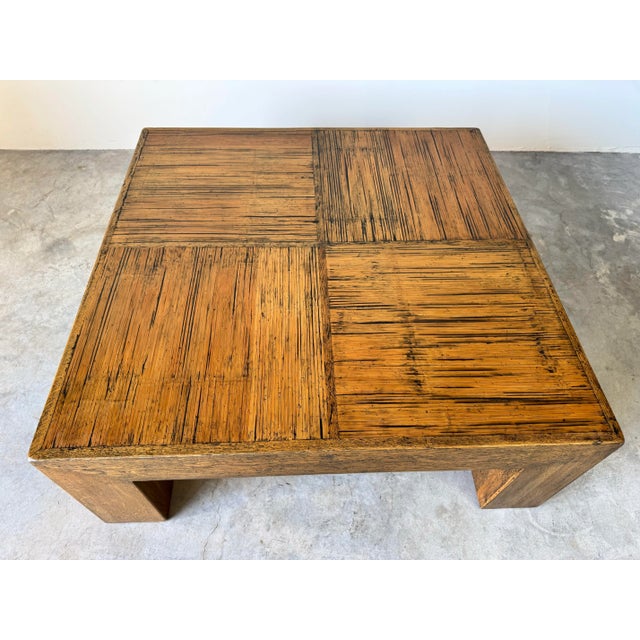 This vintage coffee table showcases a 1980s Postmodern design in the classic Parsons style, with clean, minimalist lines...