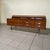 A refined 1950s sideboard with a slender structure, typical of Italian modernism from that period. Crafted from fine...