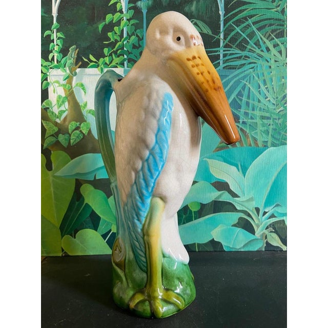 A rare Saint Clément majolica absinthe pitcher formed as a Marabou stork, circa 1900. Hand-glazed in soft whites, sky blue...