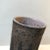 Unusual and unique cylindrical vase in chamotte clay. Partially unglazed exterior decorated with black arrow and see-...