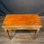 Elegant French Neoclassical game table crafted in richly figured wood with refined gilt-bronze mounts and slender tapered...