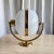 Beautiful ellipsoid shape milk glass wall light with brass elements. Perfect embodiment of the Italian mid century era...