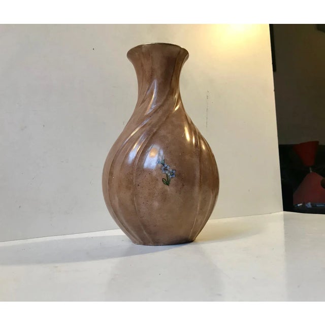 Glazed porcelain vase with swirls and hand painted flower motifs. Manufactured and designed by Lyngby Porcelæn in Denmark...