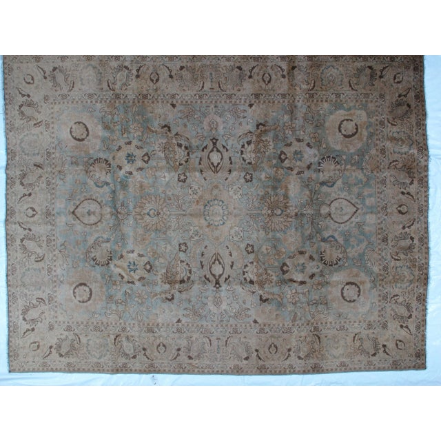 This masterpiece is a wool pile genuine handwoven antique Persian tabriz carpet . Blue field with minor wear. Thin pile.