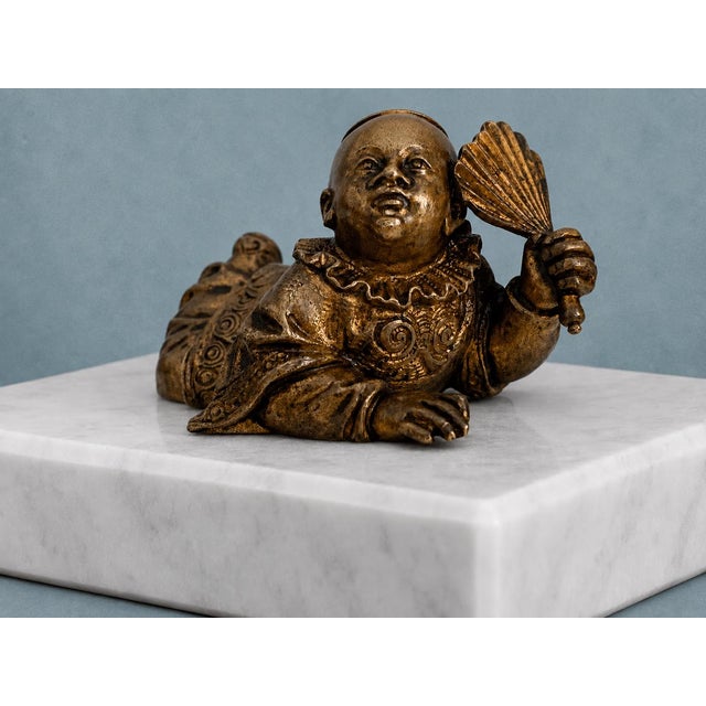 An unusual 19th-century bronze figure distinguished by a particularly charming mechanical detail: a separately constructed...
