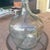 This is an authentic Hand-Painted Antique Demi-John Bottle from Normandy, France, produced circa 1900. The bottle features...
