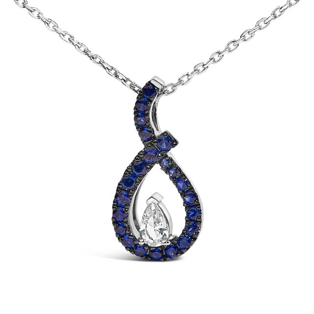 Drape your neckline with the breathtaking allure of this .925 sterling silver pendant necklace, meticulously rhodium-...