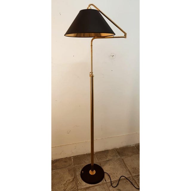 Height-Adjustable and Extendable Floor Lamp with Gold Lampshade, in Very Good conditions. Designed 1960 to 1969 European...