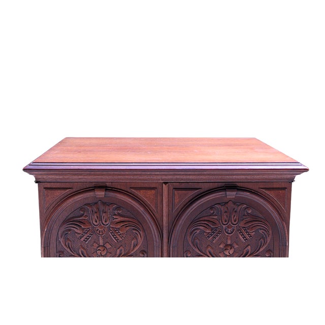 A striking antique Jacobean Revival bar cabinet by renowned American furniture maker Berkey & Gay, dating to the 1920s....
