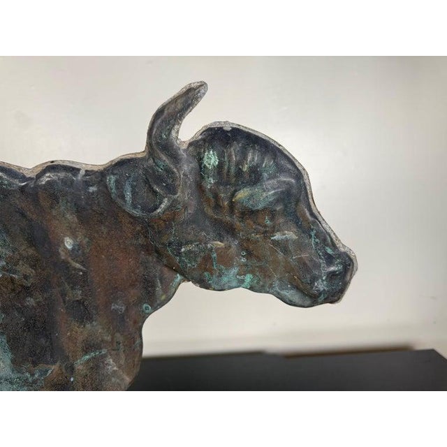 A beautifully weathered 19th century American copper bull weathervane, now presented on a newly fabricated black metal...
