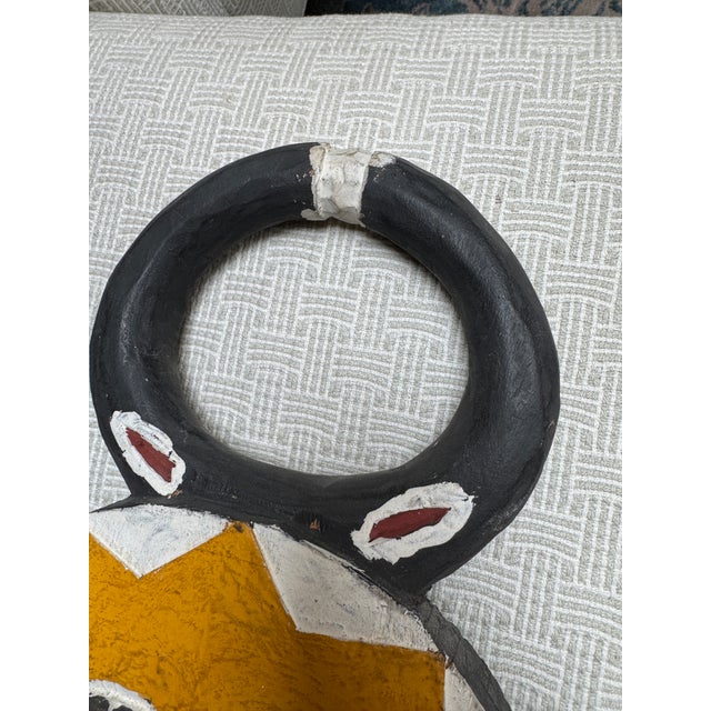 Design Plus Gallery presents an Baule Goli Ceremonial Mask from Africa. The hand carved wood is painted yellow with white,...