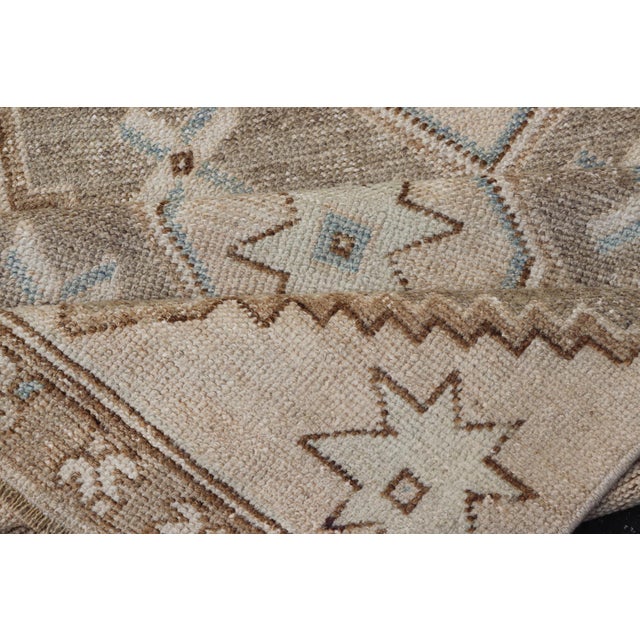 Vintage Turkish Oushak Runner With Soft Earth Tones and Geometric Star Motifs For Sale - Image 9 of 10