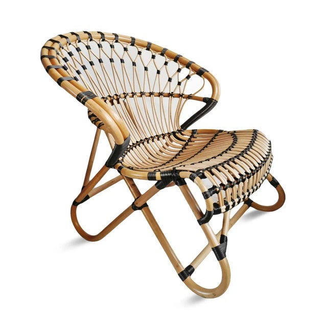 Hand crafted and woven bamboo side chair with black rattan tie detail. Curved back and seat add to its comfort and...