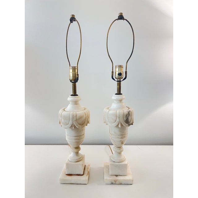 This is a beautiful pair of antique marble table lamps with a beautiful carved swag design on urn-shaped base. They have a...