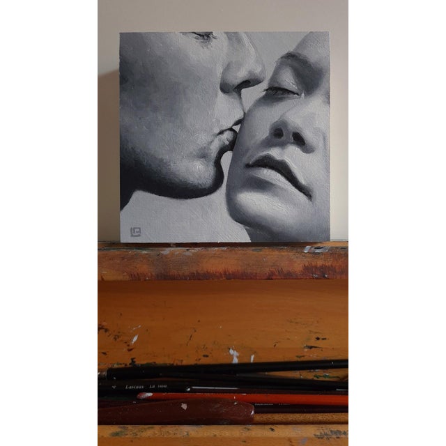 This intimate oil painting captures a tender moment between two figures, their faces nearly touching as one leans in for a...