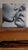 This intimate oil painting captures a tender moment between two figures, their faces nearly touching as one leans in for a...